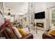 Open-concept living room with fireplace, high ceilings and an adjacent dining area at 5409 Trumpet Vine Se Trl, Mableton, GA 30126