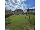 Sprawling backyard with swing set and plenty of space for outdoor activities at 590 Dot Dr, Atlanta, GA 30349