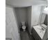 Cozy bathroom with tile flooring and a shower/tub combo at 590 Dot Dr, Atlanta, GA 30349