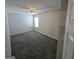 Bedroom featuring carpet, ceiling fan and a window at 590 Dot Dr, Atlanta, GA 30349