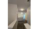 Hallway with neutral walls and plush carpeting at 590 Dot Dr, Atlanta, GA 30349