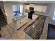 Well-equipped kitchen featuring granite countertops, an island, and modern black appliances at 590 Dot Dr, Atlanta, GA 30349
