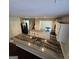Bright kitchen with an island, granite countertops and stainless steel appliances at 590 Dot Dr, Atlanta, GA 30349