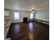 Spacious living room featuring hardwood floors, a fireplace, and lots of natural light at 590 Dot Dr, Atlanta, GA 30349