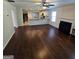 Open concept living space with kitchen, fireplace and hardwood flooring at 590 Dot Dr, Atlanta, GA 30349
