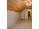 Finished attic with a wood ceiling, dormer windows, and neutral carpeting at 145 County Line Ct, Fayetteville, GA 30215