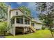 Inviting screened porch overlooking the backyard, perfect for enjoying nature and entertaining at 145 County Line Ct, Fayetteville, GA 30215