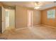 A bedroom featuring a window providing natural light and a ceiling fan for climate control at 145 County Line Ct, Fayetteville, GA 30215
