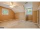A bedroom featuring two windows providing natural light and a ceiling fan for climate control at 145 County Line Ct, Fayetteville, GA 30215