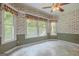 Bright dining area surrounded by windows, offering natural light and a pleasant space for meals at 145 County Line Ct, Fayetteville, GA 30215