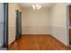 Traditional dining room featuring hardwood floors and classic chandelier lighting at 145 County Line Ct, Fayetteville, GA 30215