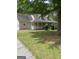 Charming home featuring a welcoming front porch, dormer windows, and a two-car attached garage at 145 County Line Ct, Fayetteville, GA 30215