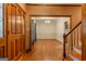 Spacious entry featuring gleaming hardwood floors and an elegant staircase at 145 County Line Ct, Fayetteville, GA 30215
