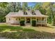 Charming traditional home featuring a welcoming porch and well-maintained front yard at 145 County Line Ct, Fayetteville, GA 30215