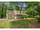 Traditional home with a well-kept lawn and covered front porch at 145 County Line Ct, Fayetteville, GA 30215