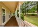 Covered front porch with stately columns, offering a welcoming entrance to the home at 145 County Line Ct, Fayetteville, GA 30215