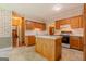 Well-equipped kitchen featuring wood cabinets, an island, and modern appliances, creating a functional cooking area at 145 County Line Ct, Fayetteville, GA 30215