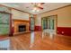 Cozy living room with a fireplace, hardwood floors, and ample natural light at 145 County Line Ct, Fayetteville, GA 30215
