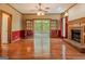 Elegant living room with brick fireplace and french doors to sunroom at 145 County Line Ct, Fayetteville, GA 30215