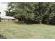 Expansive backyard featuring a detached garage at 8394 Banks Mill Rd, Douglasville, GA 30135