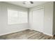 Cozy bedroom with a ceiling fan, closet, and a large window for natural light at 8394 Banks Mill Rd, Douglasville, GA 30135