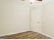 Simple bedroom featuring a ceiling fan, door, and natural light at 8394 Banks Mill Rd, Douglasville, GA 30135