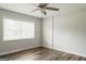 Well-lit bedroom featuring new hardwood floors and window at 8394 Banks Mill Rd, Douglasville, GA 30135