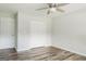 Neat bedroom featuring hardwood floors, closet and ceiling fan at 8394 Banks Mill Rd, Douglasville, GA 30135