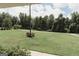 Lush front yard with manicured landscaping and mature trees, creating a welcoming curb appeal at 8394 Banks Mill Rd, Douglasville, GA 30135