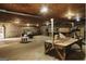 Large garage and workspace featuring a golf cart, work benches, and concrete block walls at 8394 Banks Mill Rd, Douglasville, GA 30135