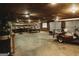 View of spacious garage with work bench and golf cart, offering ample space for projects and storage at 8394 Banks Mill Rd, Douglasville, GA 30135