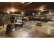 Spacious garage with high ceilings, lighting, and a golf cart at 8394 Banks Mill Rd, Douglasville, GA 30135