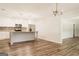 Expansive open-concept kitchen with granite countertops, island, and stainless steel appliances at 8394 Banks Mill Rd, Douglasville, GA 30135