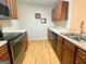 Well-appointed kitchen featuring stainless steel appliances, and ample counter space at 1843 Grove Way, Hampton, GA 30228