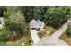 Aerial view of a lovely home with landscaping, an attached garage, and a circular driveway at 228 Hunt Club Cir, Temple, GA 30179
