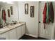 Bathroom featuring a double vanity with granite countertops and white cabinetry at 228 Hunt Club Cir, Temple, GA 30179