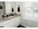 Bright bathroom featuring a vanity with granite countertops and great natural light at 228 Hunt Club Cir, Temple, GA 30179