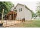 Back exterior featuring a deck, a fire pit, neutral siding, and a sloped yard at 228 Hunt Club Cir, Temple, GA 30179