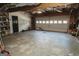 Clean and expansive two-car garage with automatic overhead door and work area at 228 Hunt Club Cir, Temple, GA 30179