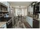 Well-lit kitchen featuring stainless steel appliances, light blue cabinets, granite countertops and a dining area at 228 Hunt Club Cir, Temple, GA 30179