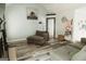 Inviting living room featuring a modern fireplace, wood floors, and neutral paint at 228 Hunt Club Cir, Temple, GA 30179