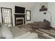 Inviting living room featuring a modern fireplace, wood floors, and neutral paint at 228 Hunt Club Cir, Temple, GA 30179