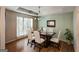Elegant dining room features a chandelier, hardwood floors, and a table set for a special occasion at 300 Fox Trail Dr, South Fulton, GA 30349