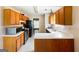 Spacious kitchen featuring stainless steel appliances, wood cabinets, and a bright, functional layout at 300 Fox Trail Dr, South Fulton, GA 30349