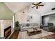Cozy living room boasts hardwood floors, a fireplace, and neutral-toned furniture for relaxation at 300 Fox Trail Dr, South Fulton, GA 30349