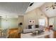 Bright living room showcasing vaulted ceilings, hardwood floors, neutral colors and a cozy seating area at 300 Fox Trail Dr, South Fulton, GA 30349