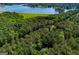 Picturesque aerial view showing wooded property, lake access, and the surrounding landscape at 6026 Belle Meade Ct, Villa Rica, GA 30180