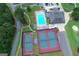 Aerial view of a community clubhouse, pool, and tennis courts at 6026 Belle Meade Ct, Villa Rica, GA 30180