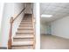 Basement staircase leading to a finished room with tiled ceiling at 6026 Belle Meade Ct, Villa Rica, GA 30180