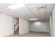 Spacious carpeted basement area with stairs and a tiled ceiling at 6026 Belle Meade Ct, Villa Rica, GA 30180